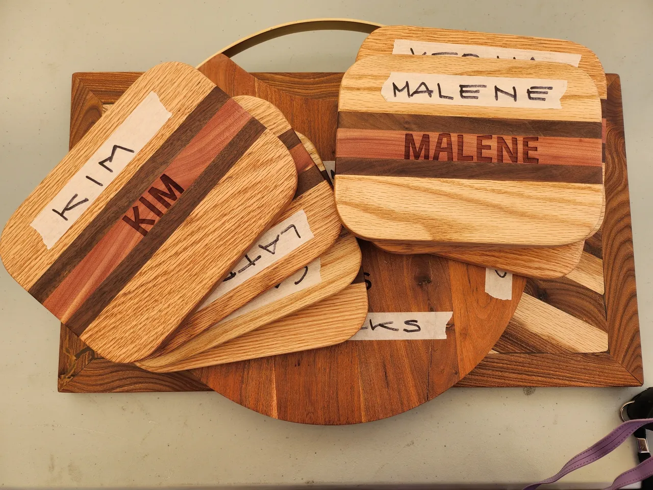 A wooden board with several different wood items on it.