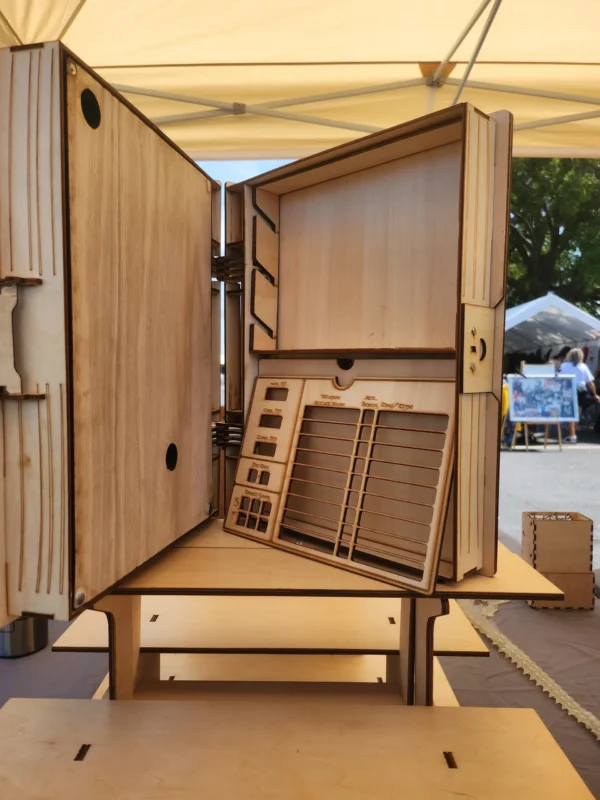 A wooden table with an open door and some boxes