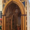 A wooden structure with a cathedral like design.