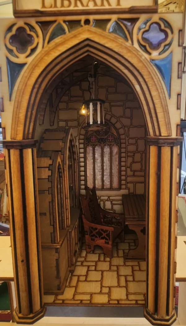 A room with a wooden arch and a window.