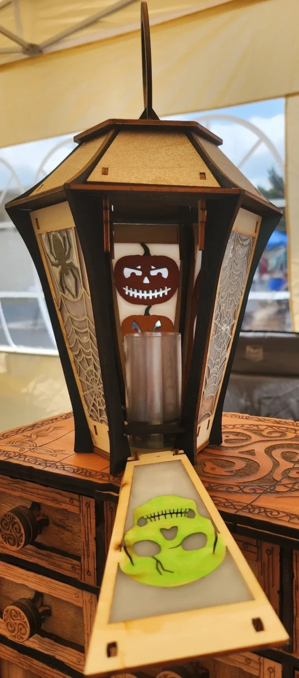 A candle holder with a creepy face on it.