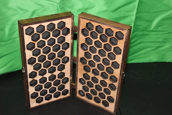 A wooden case with many holes in it