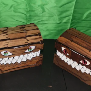 Two wooden chests with faces made out of marshmallows.