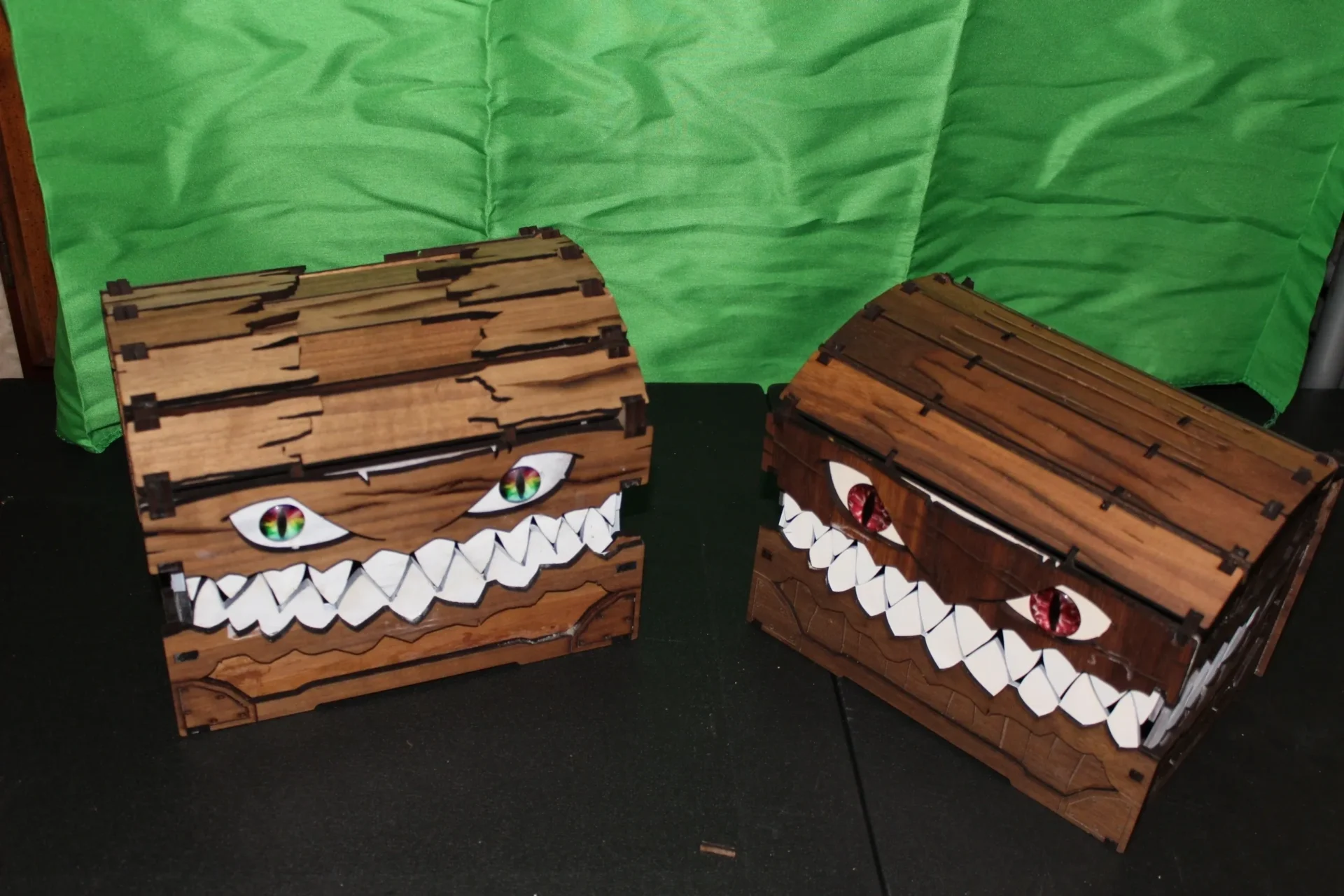 Two wooden chests with faces made out of marshmallows.