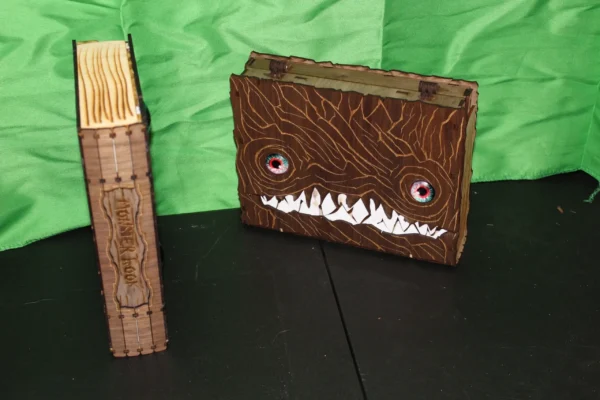 A wooden box with an evil face on it.