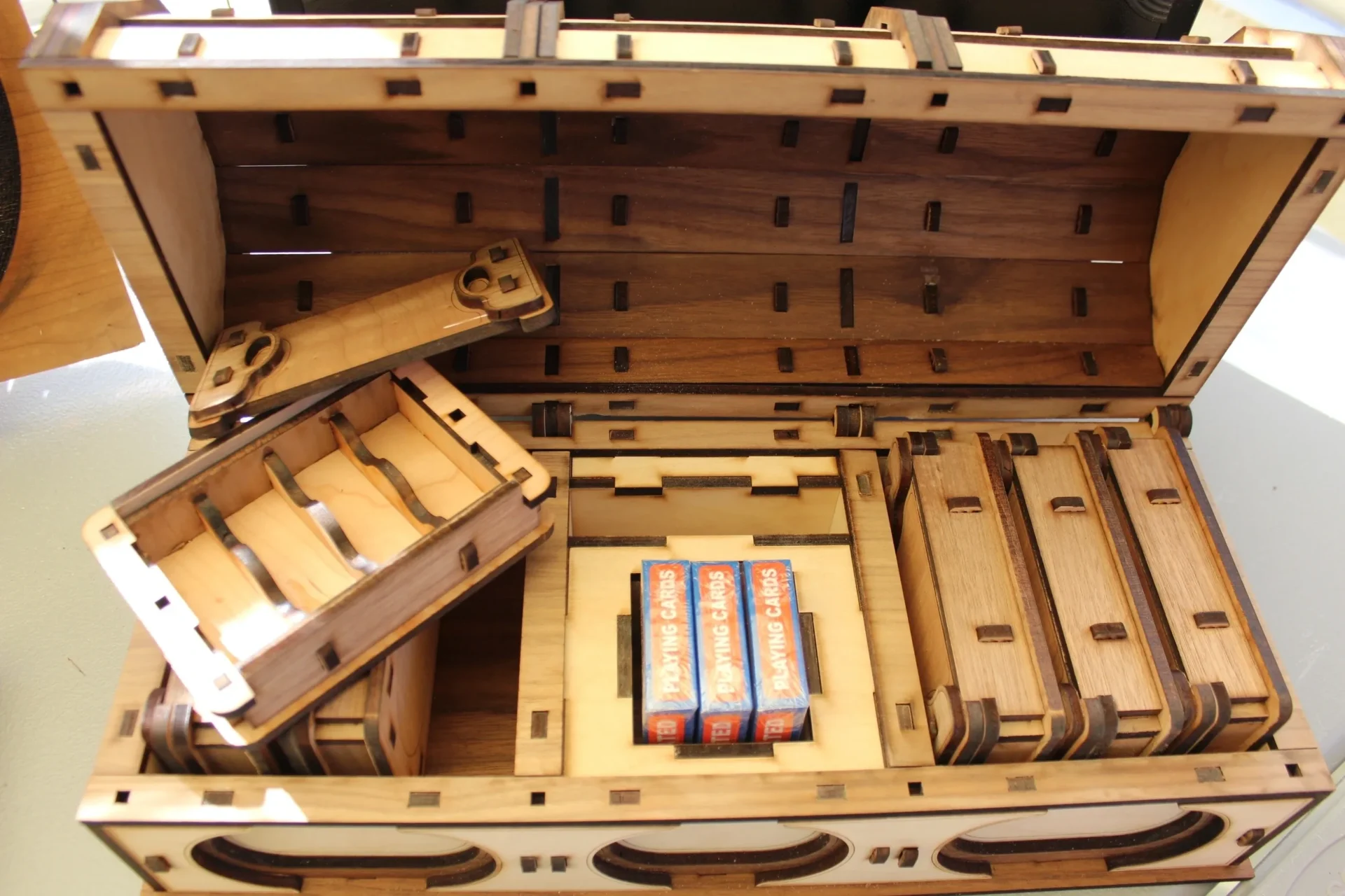 A wooden box with many different items inside.