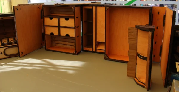 A room with many wooden cabinets and drawers.