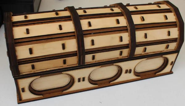 A wooden box with some brown and white designs